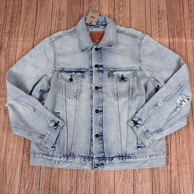Levi's denim trucker jacket in light wash on wood background